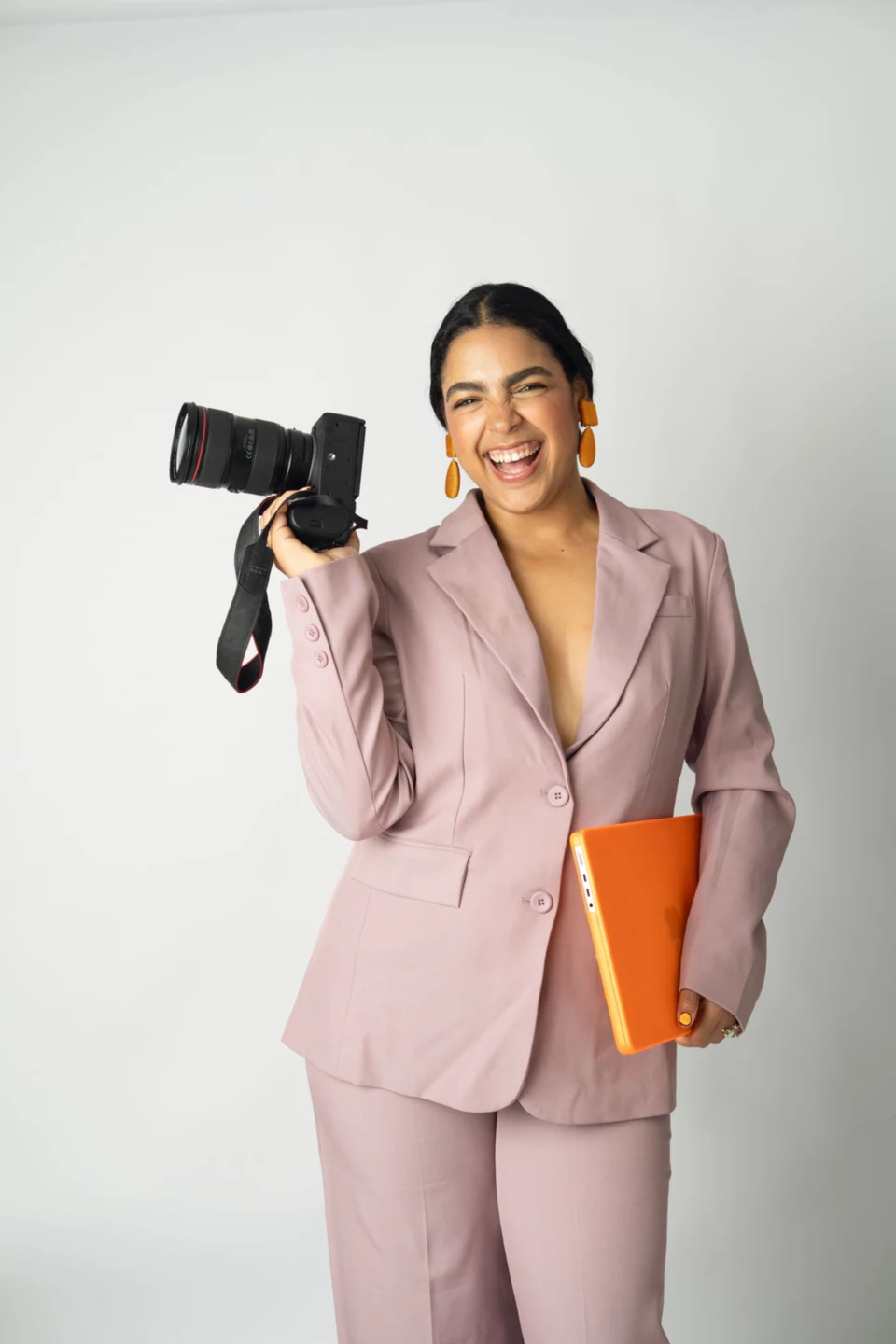 Diana Guillén holding her camera